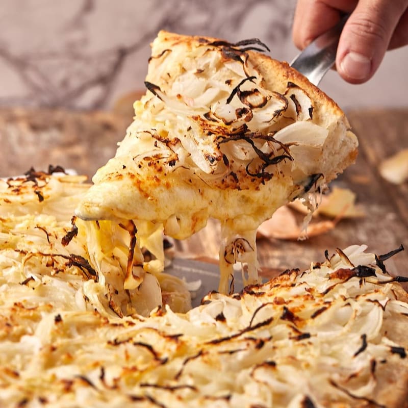 Los precios en Torino Norte varían según el tipo de pizza y el tamaño: desde $11.300 para una pizza muzzarella mediana hasta $23.000 para una pizza jamón y morrones grande. (Foto: Instagram @torinonorte)