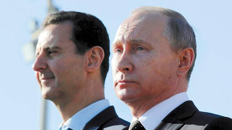 Vladimir Putin, presidente de Rusia (der.), y Bashar al-Assad, el líder de Siria