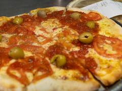 Pizzas a $26: cuándo y dónde obtener la promoción para comer una grande de muzzarella