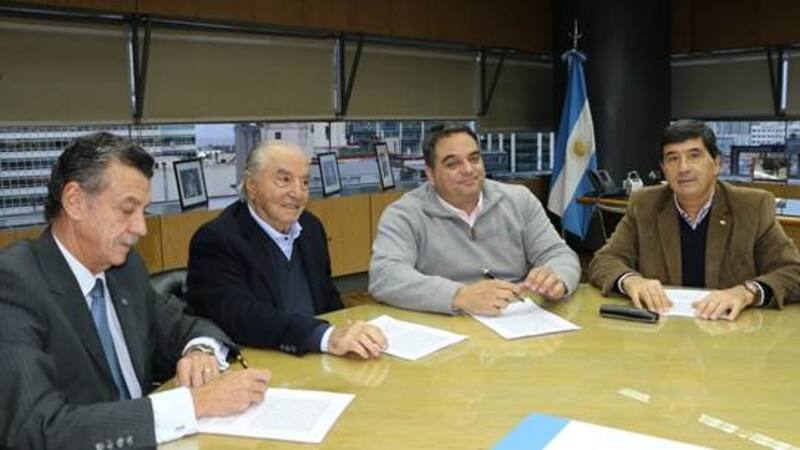 El secretario general de la CAC, Mario Grinman; el titular de Faecys, Armando Cavalieri; el ministro de Trabajo, Jorge Triaca, y el presidente de CAME. Gerardo Díaz Beltrán