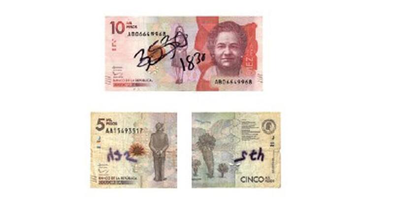 Billete colombiano manchado y roto. (Fuente: Archivo)