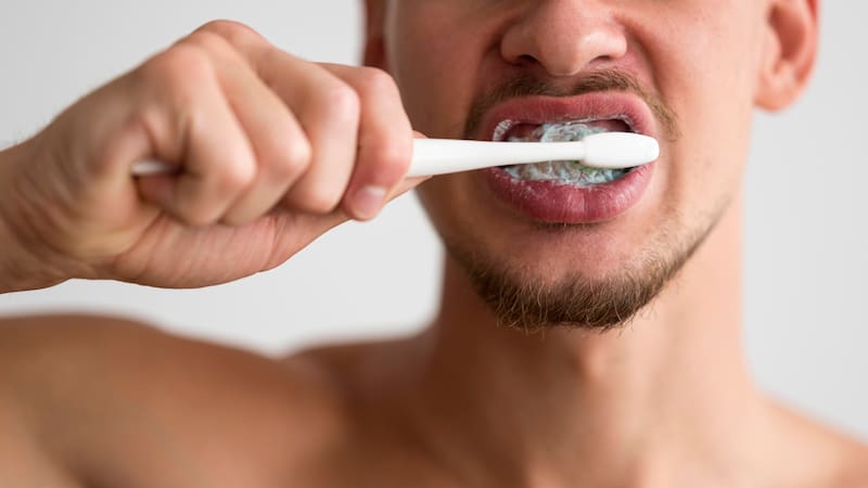 Brushing twice a day with fluoride toothpaste for about two minutes is the standard recommendation.