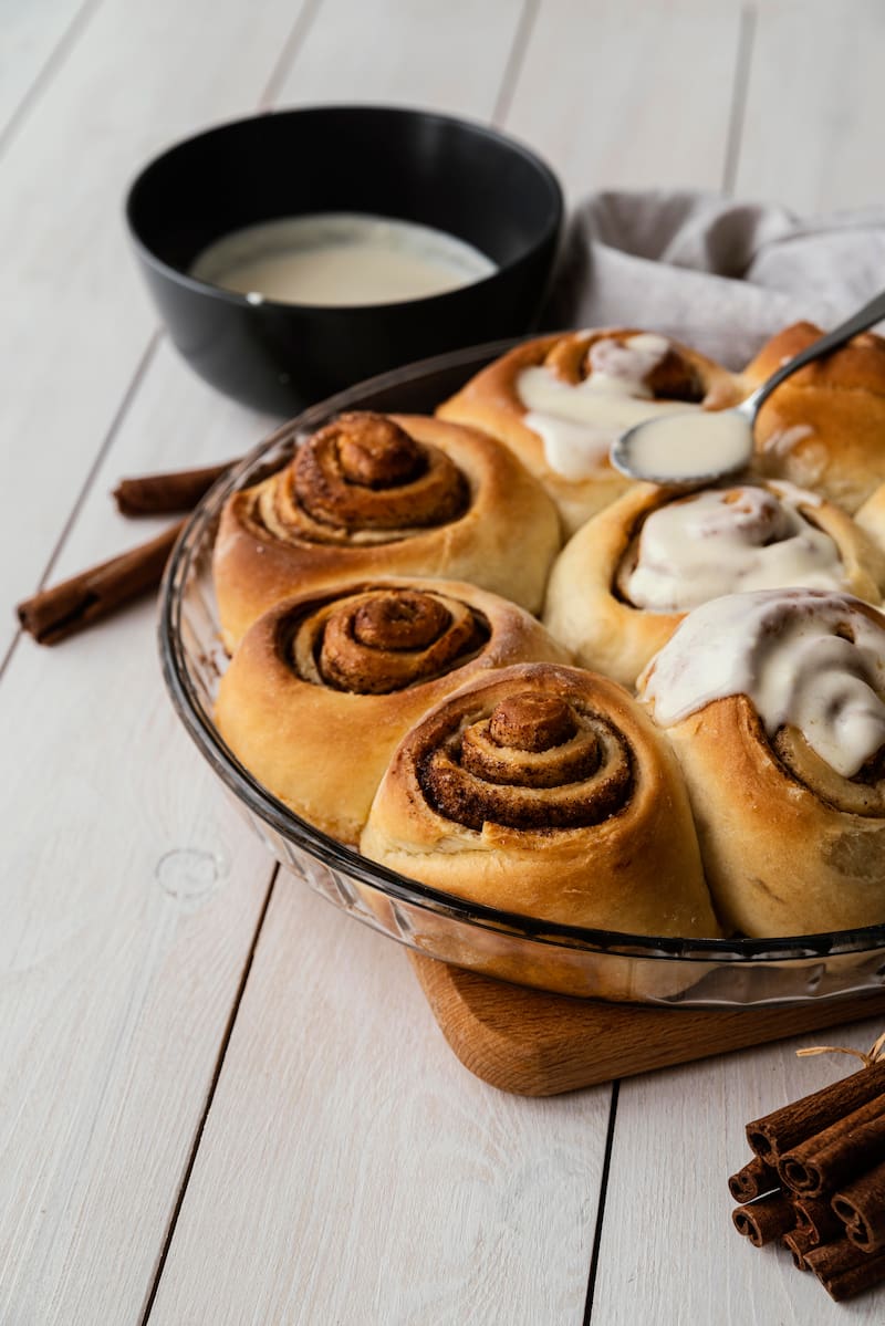 Maple cardamom buns with a soft, gooey center and a sweet maple glaze.