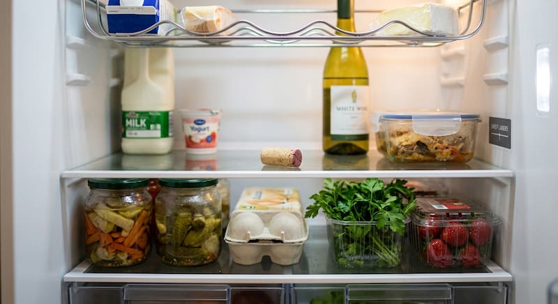 Food odors can build up inside a refrigerator as different ingredients and prepared dishes share the same enclosed space.