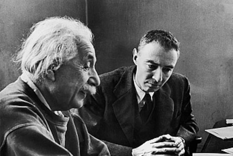 Credit: Photo by Alfred Eisenstaedt/The LIFE Picture Collection/Shutterstock (12084712a) German-born physicist Dr. Albert Einstein (1879 - 1955) (left) writes on a piece of paper as he talk with Dr. Robert Oppenheimer (1904 - 1967) at Princeton's Institute of Advanced Study where both men taught, Princeton, New Jersey, December 1947. Einstein & Oppenheimer Talk Shop, Princeton, New Jersey, USA