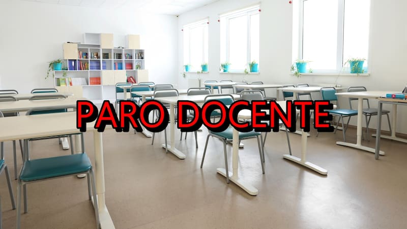 Empty school classroom with desks, windows and chairs