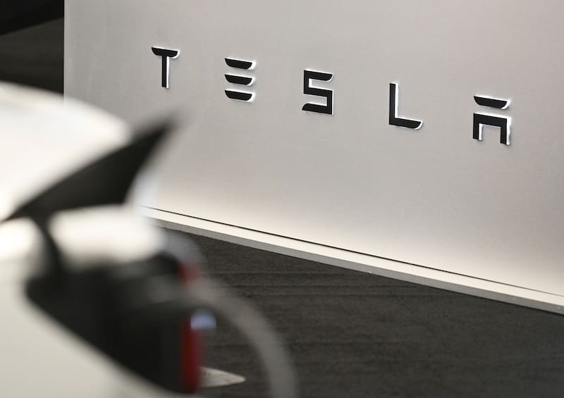 Tesla signage at the Montreal Auto Show in Montreal, Quebec, Canada, on Thursday, Jan. 15, 2026. Founded by the Montreal Automobile Dealers Corporation, the event showcases the latest innovations from concept vehicles to new production models. Photographer: Graham Hughes/Bloomberg