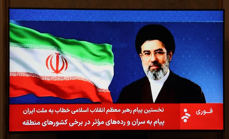 TEHRAN (IRAN (Islamic Republic Of)), 12/03/2026.- An image of Iranian supreme leader Ayatollah Mojtaba Khamenei shown on Iranian State Television, as a presenter reads his first address to the nation in Tehran, Iran, 12 March 2026. Iran will keep blocking the Strait of Hormuz, according to the statement attributed to the new supreme leader, who has not been seen in public since succeeding his father. (Teherán) EFE/EPA/ABEDIN TAHERKENAREH