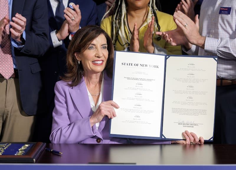New York Governor Kathy Hochul holds the signed state budget document Thursday in Albany, New York.