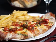 El bodegón con puntuación “casi perfecta”: tiene las mejores milanesas de Buenos Aires y sirve platos gigantes de pasta y carne