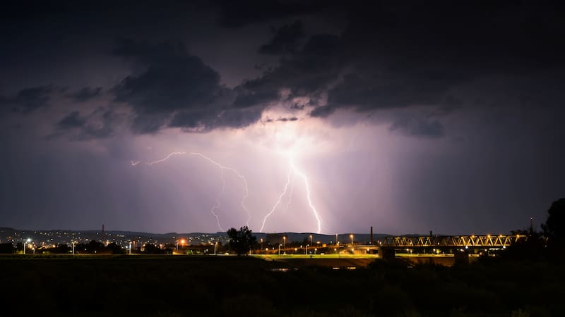 Multiple lightning during thunderstorm at night, over hills near croatian city of Slavonski Brod