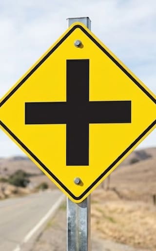 Ver una señal con una cruz negra sobre un fondo amarillo: qué significa y para qué se usa