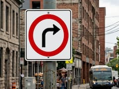Qué significa la señal de círculo rojo con una flecha negra curva en el medio: ¿es obligatorio seguir esa dirección?
