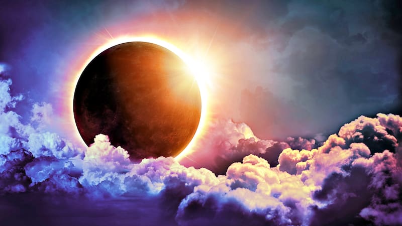 Solar Eclipse In Clouds - Moon image furnished by NASA