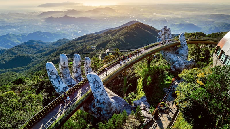 Tourist walking at Golden bridge in Bana hills, Da nang, Vietnam.