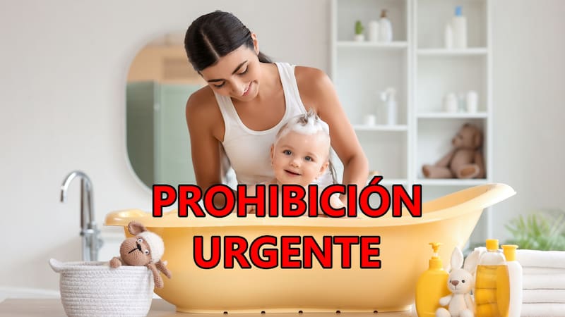 Young mother bathing her baby at home